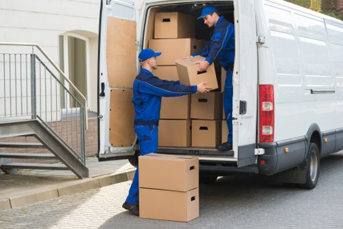 Furniture collection team handling bulky household items in Watford