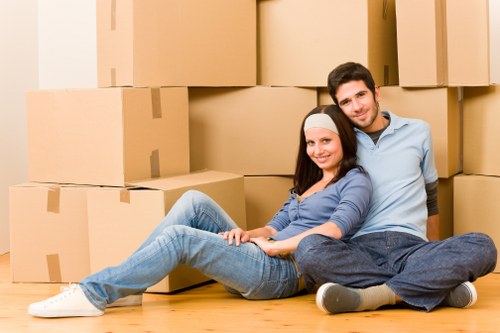 Loading business equipment into a removals vehicle in Watford