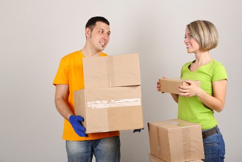 Fragile household items being carefully wrapped for transport in Watford
