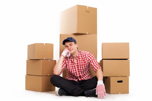 Organised office relocation with labelled boxes and desks