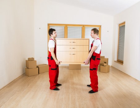 Packed boxes and furniture ready for flat relocation in Watford